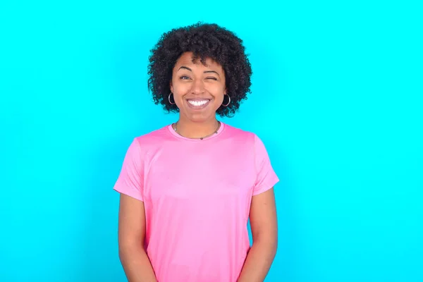 Coquettish Young African American Woman Wearing Pink Shirt Blue Background — Fotografia de Stock