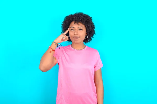 Young African American Woman Wearing Pink Shirt Blue Background Tries — Stockfoto