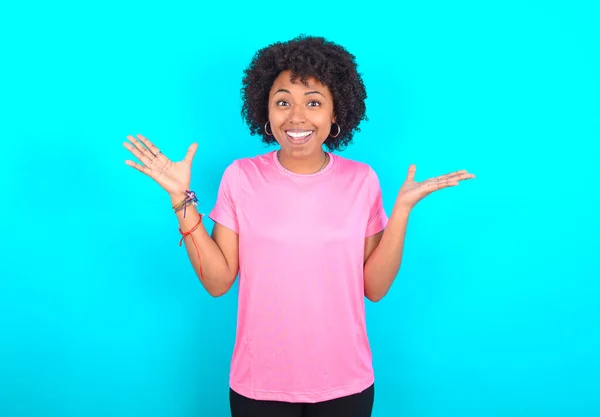 Young African American Woman Wearing Pink Shirt Blue Background Celebrating — 스톡 사진
