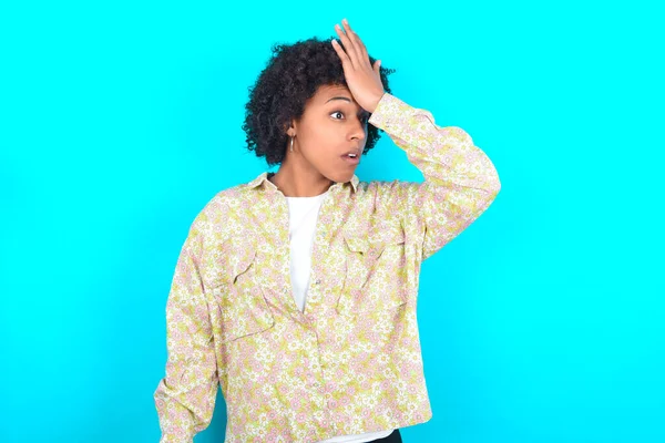 Young African American Woman Wearing Floral Shirt Blue Background Surprised — Stock Fotó