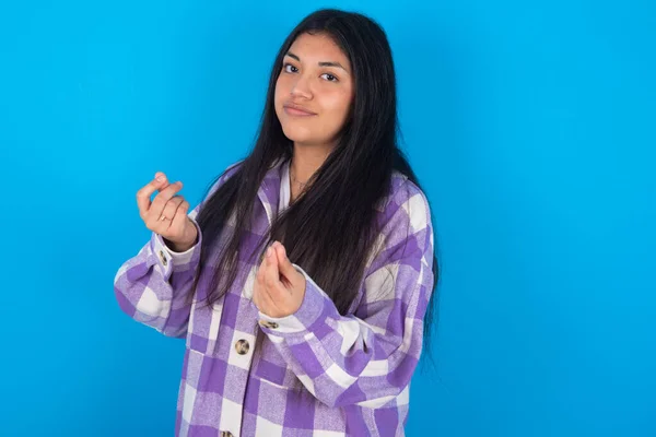 Young Latin Woman Wearing Plaid Shirt Blue Background Doing Money — стоковое фото