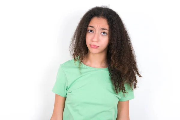 Displeased Upset Teenager Girl Afro Hairstyle Wearing White Shirt Green — ストック写真