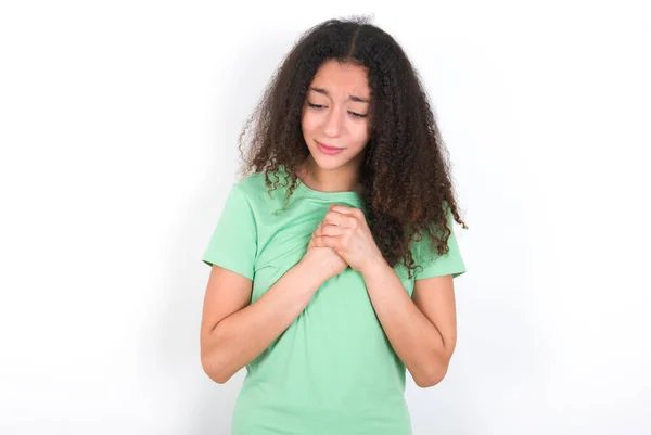 Sad Teenager Girl Afro Hairstyle Wearing White Shirt Green Background — Foto de Stock