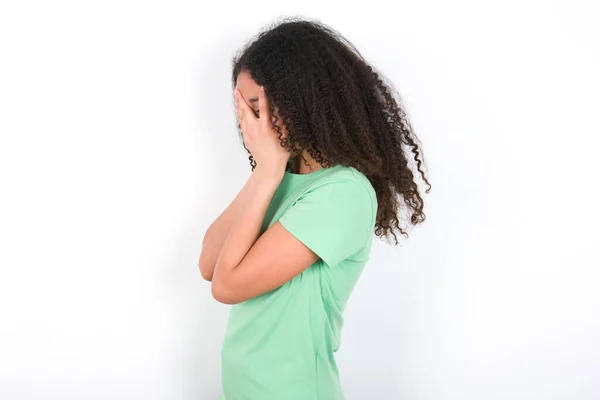 Sad Teenager Girl Afro Hairstyle Wearing White Shirt Green Background —  Fotos de Stock