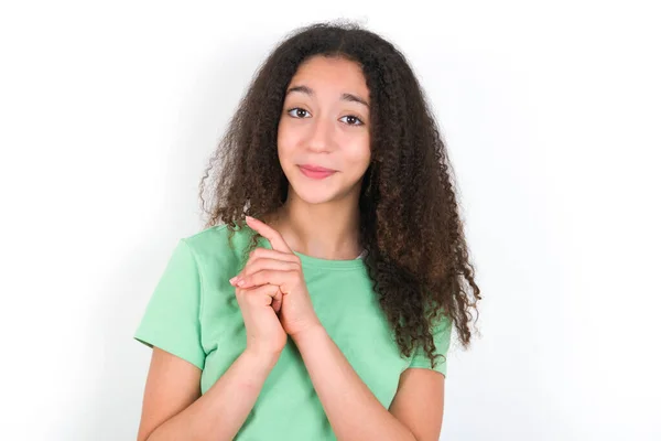 Positive Teenager Girl Afro Hairstyle Wearing White Shirt Green Background — Zdjęcie stockowe
