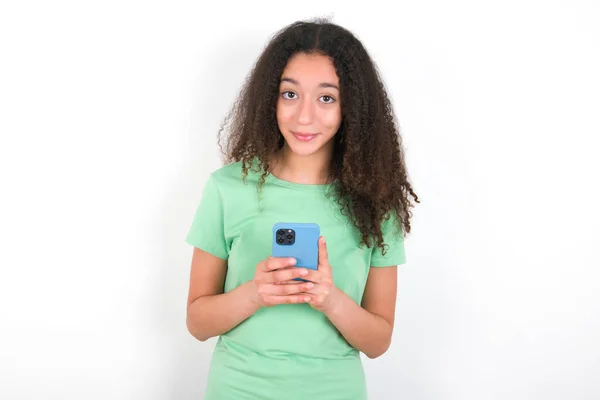 Teenager Girl Afro Hairstyle Wearing White Shirt Green Background Enjoys — Fotografia de Stock