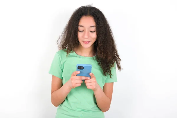 Excited Teenager Girl Afro Hairstyle Wearing White Shirt Green Background — Foto de Stock