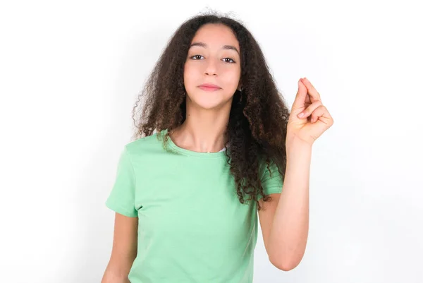 Teenager Girl Afro Hairstyle Wearing White Shirt Green Background Pointing — Photo