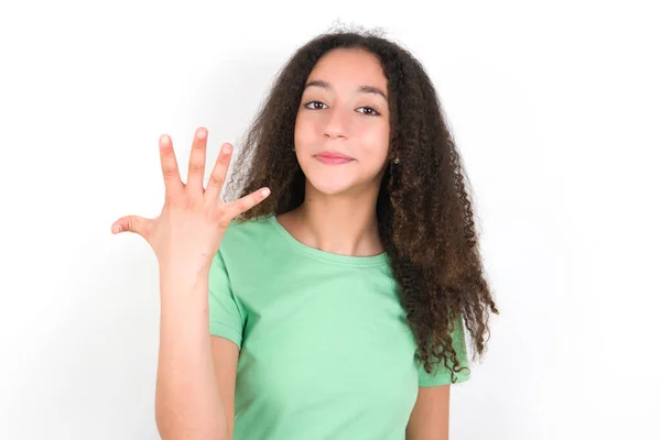 Teenager Girl Afro Hairstyle Wearing White Shirt Green Background Smiling — Zdjęcie stockowe