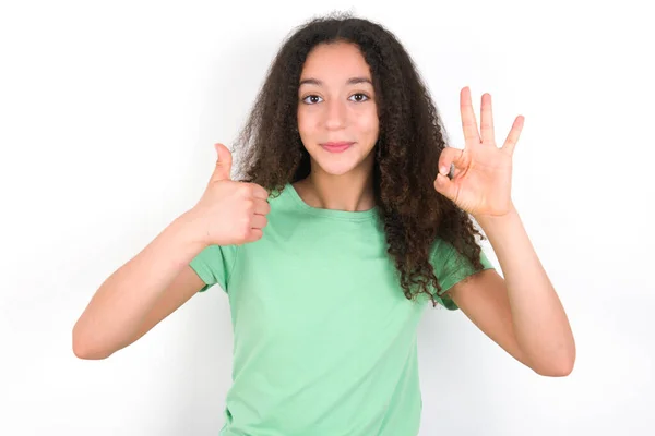 Teenager Girl Afro Hairstyle Wearing White Shirt Green Background Smiling — Fotografia de Stock