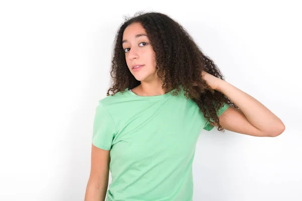 Teenager Girl Afro Hairstyle Wearing White Shirt Green Background Stressed — Stockfoto