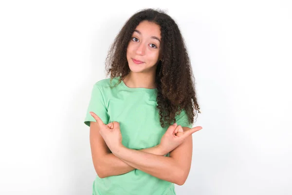 Teenager Girl Afro Hairstyle Wearing White Shirt Green Background Crosses — Zdjęcie stockowe