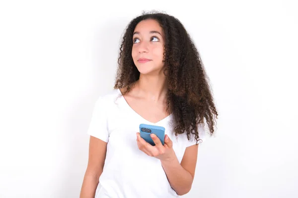 Teenager Girl Afro Hairstyle Wearing White Shirt White Background Holds — Foto de Stock