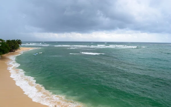 Tropical beach in monsoon season — Stock Photo, Image