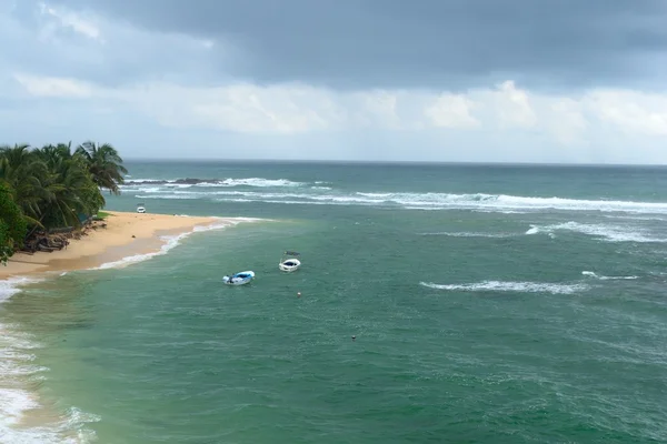 Tropical beach in monsoon season — Stock Photo, Image