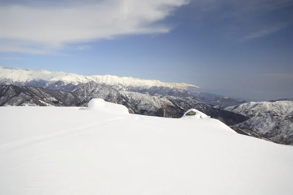 Alpské cloudscape v zimě — Stock fotografie