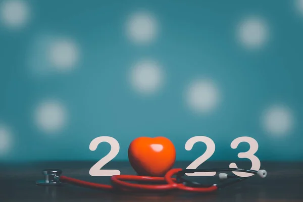 2023 with red heart and stethoscope, health care, health insurance, healthy life concept, copy space for banner.