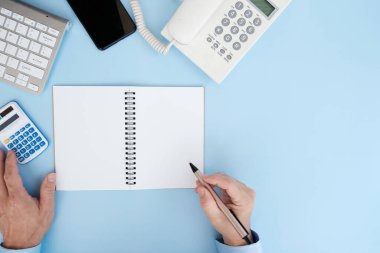business concept. workplace with a calculator and a pen.