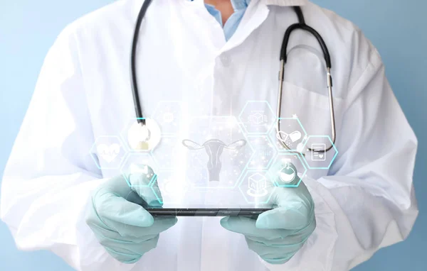doctor holding tablet computer with medical stethoscope and digital device