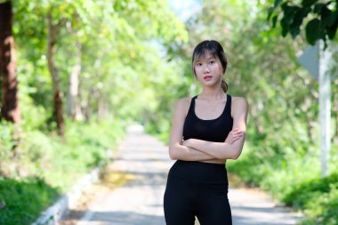 young Asian beautiful woman at workout outdoors 