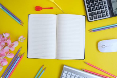 colorful background with stationary items and darts 