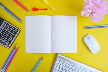 colorful background with stationary items and darts 