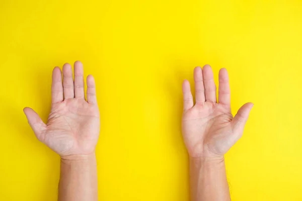 Palm Hands Yellow Background — Fotografia de Stock