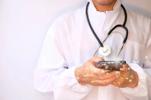 doctor with stethoscope and phone