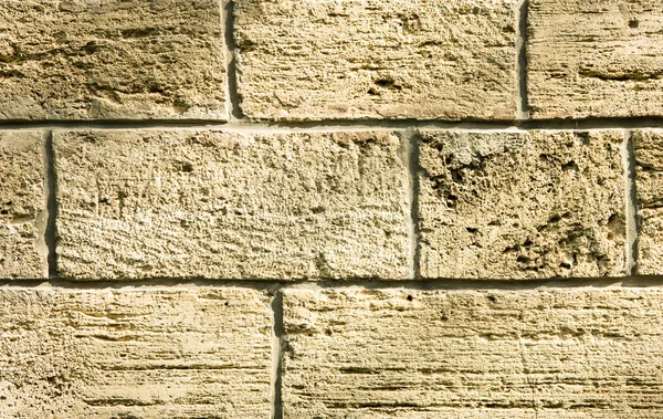 ladrillo de piedra natural color crema amarillento fondo — Foto de