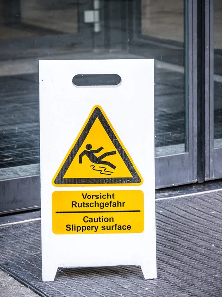 Caution slippery surface sign — Stock Photo, Image