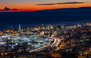 GENOA (GENOVA), ITALY, JANUARY 10, 2022 - Aerial view of the city of Genoa (Genova) at dusk, Italy.