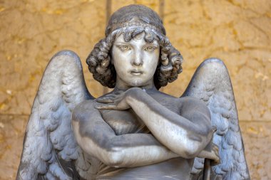 Oneto family's tomb. Portrait of loving angel on marble, monumental cemetery of Genoa, Italy, one of the most important monumental cemeteries in Europe.