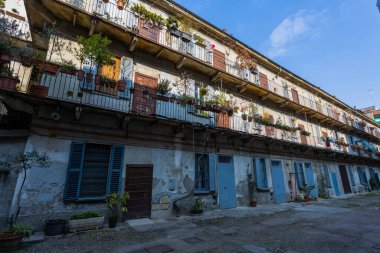 MILAN, ITALY, MARCH 5, 2022 - Private street called Ca'Longa in Piero della Franceca street, the original famous and historical railing houses in Milan, Italy.