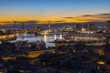GENOA, ITALY, JANUARY 10, 2022 - Aerial view of the city of Genoa at sunset, Italy.