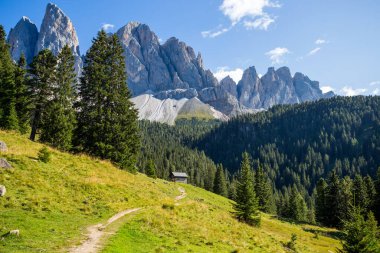 View of the path towards The Odle group (Geislergruppe) in the Dolomitics alps, South Tyrol, Italy.