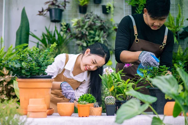 Happily Asian Young Gardener Couple Wearing Apron Use Garden Equipment — Fotografia de Stock