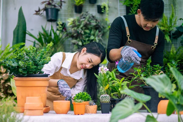 Happily Asian Young Gardener Couple Wearing Apron Use Garden Equipment — Fotografia de Stock