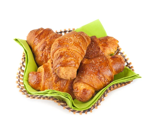 Frisch gebackene Croissants auf weißem Hintergrund — Stockfoto