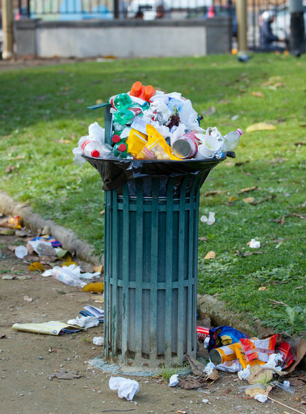 Trash basket full in park