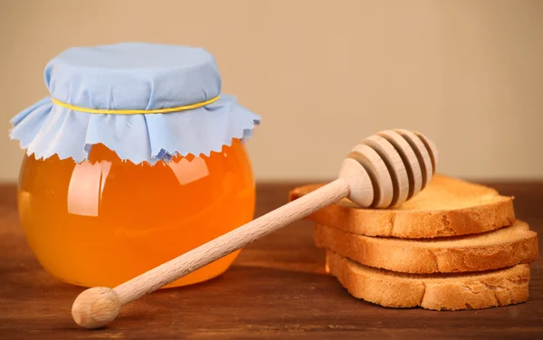 Pot of honey and rusks — Stock Photo, Image