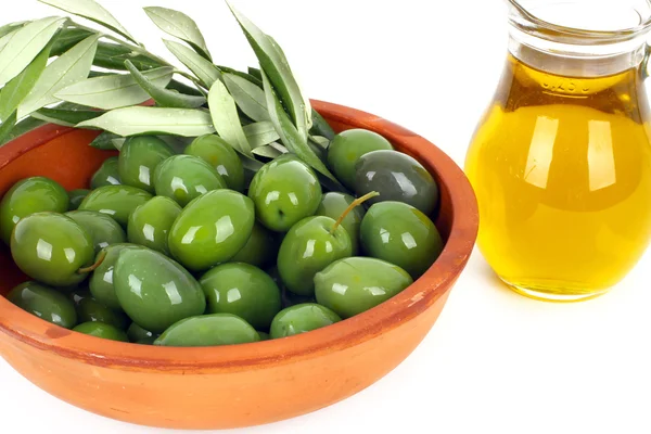 Olivový olej a větve olivovník — Stock fotografie