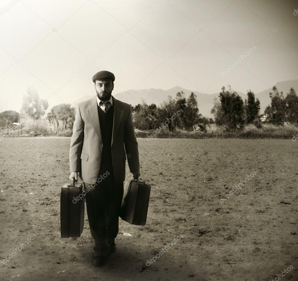 Emigrant with the suitcases