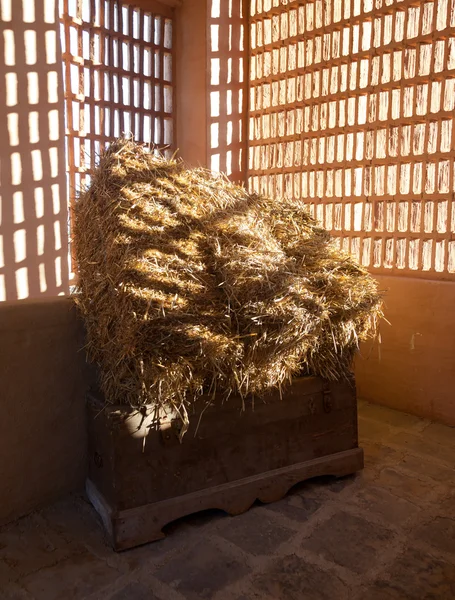 Barn with the sun from outside and straw and hay — Stock Photo, Image