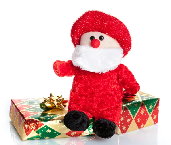 Bunte Geschenkboxen mit Weihnachtsmann-Puppe — Stockfoto