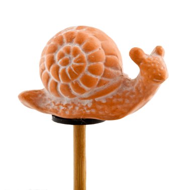 Snail in clay on wooden stick clipart