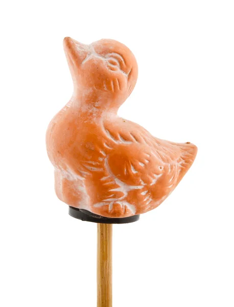 Duck in clay on wooden stick — Stock Photo, Image