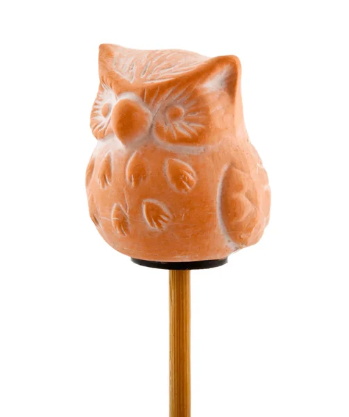 Owl in clay on wooden stick — Stock Photo, Image