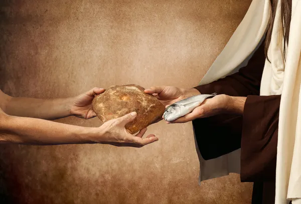 Jesus gives bread and fish — Stock Photo, Image