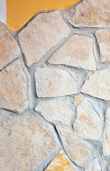 Wall lined with porphyry stones — Stock Photo, Image