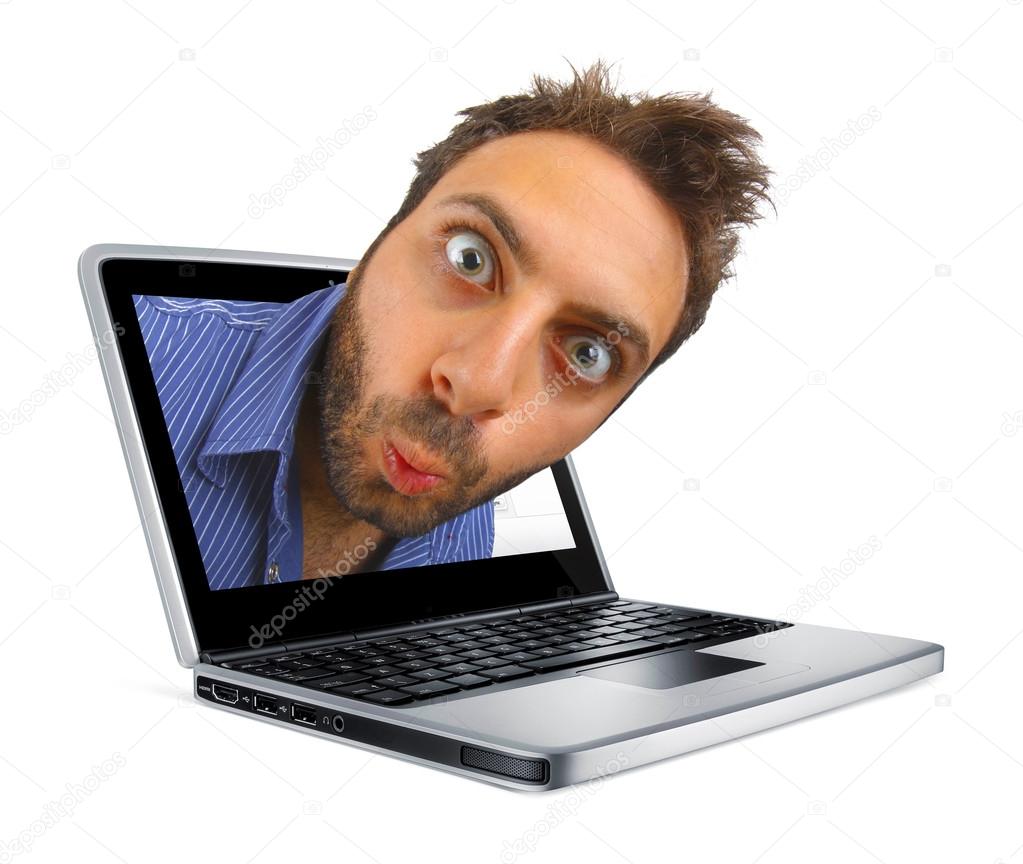 Young boy with a surprised expression in the laptop